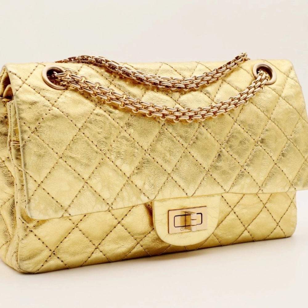 WHATS A LADY TO DO WITH TWO GOLD 
CHANEL BAGS SEE VIDEO!!!!!!
